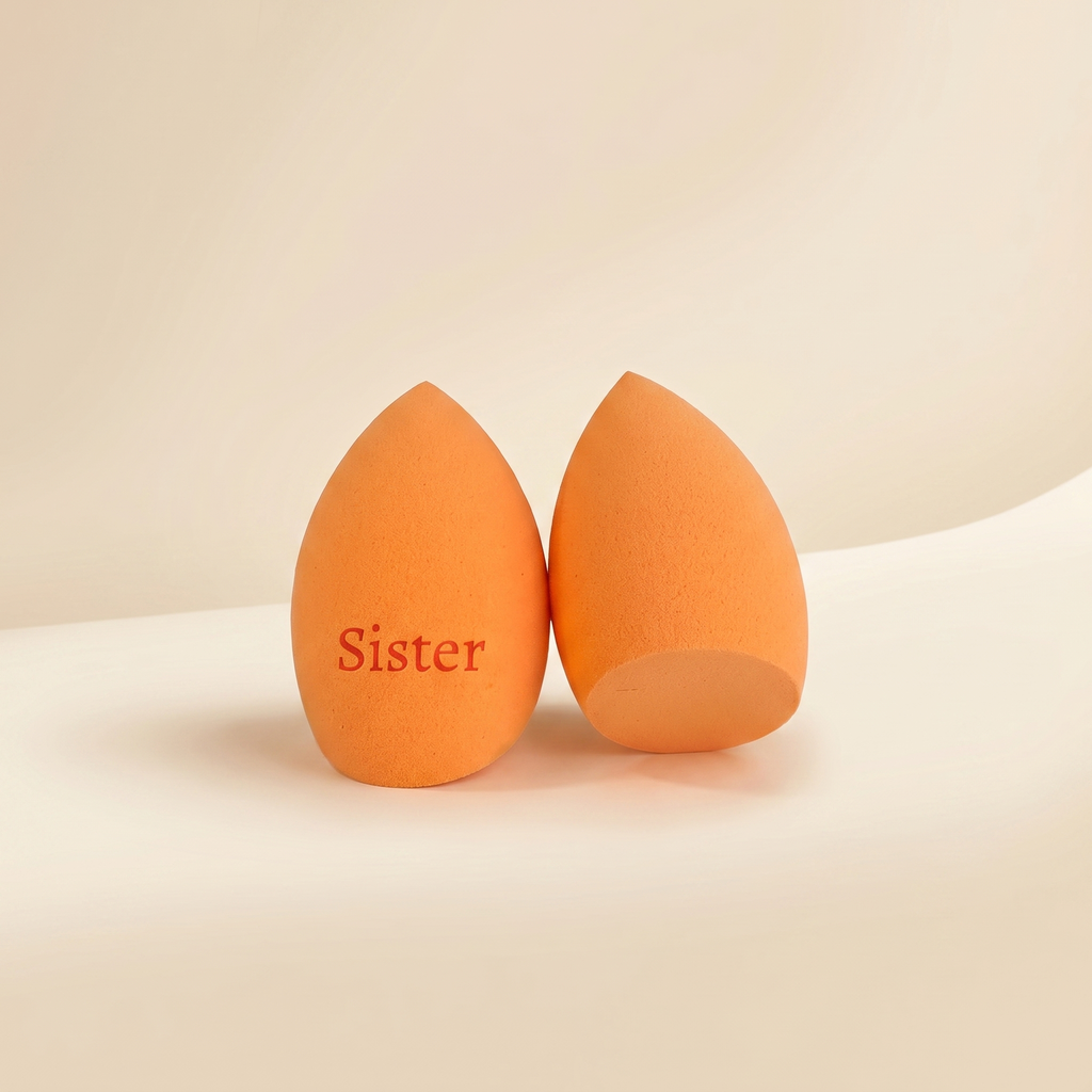 Oranžový beauty blender se zkosením dole s gravírovaným nápisem Sister